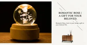 Detail of 3D crystal ball music box with laser-engraved rose and LED wooden base