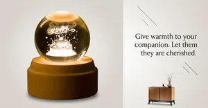 Macro detail of 3D laser engraved birthday cake inside crystal ball with wooden base