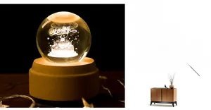 Macro detail of 3D laser engraved birthday cake inside crystal ball with wooden base