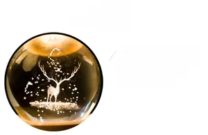Detail of 3D laser engraved crystal ball with elk pattern and warm glowing wood base