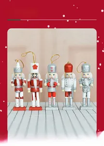 Detailed view of five 13cm wooden nutcracker ornaments with festive glitter accents