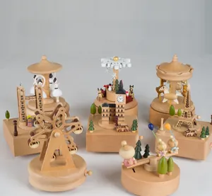 Detail of wooden mechanical music boxes featuring Big Ben and Ferris wheel designs