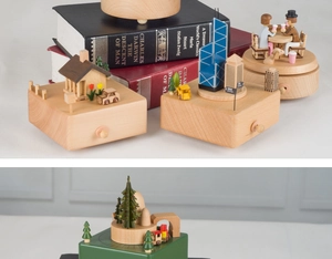 Detailed view of handcrafted wooden music boxes with various miniature city and forest scenes