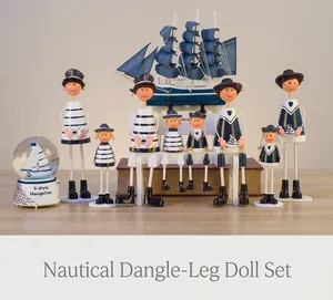 Detail of Mediterranean navy wooden doll set with blue sailboat and nautical crystal ball