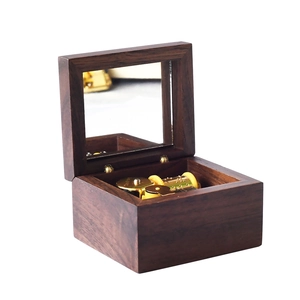 Handcrafted walnut wood music box with mechanical gold movement and interior mirror