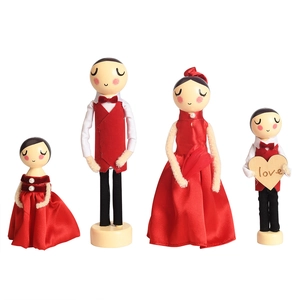 European wooden doll set with red outfits and heart accessory for home wedding decor