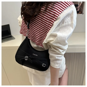 Detail of black crescent bag with silver Fashion logo, buckle, and lace-up straps