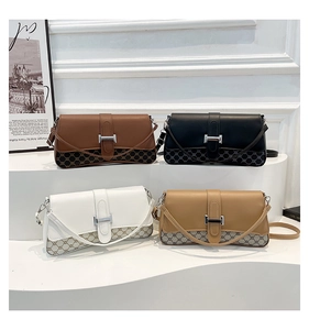 Close-up of vintage crossbody bags with geometric patterns and silver H buckles