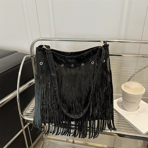 Chic black tassel tote bag in velvet fabric with silver eyelets and a bohemian style
