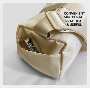 Close-up of functional side pocket on beige nylon Boston bag with shoulder strap