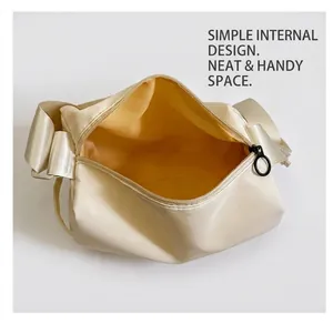 Detailed interior of nylon pillow bag with bright yellow lining and spacious main compartment