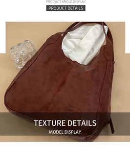 Close-up of brown tote bag showing vintage PU leather texture and soft finish