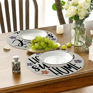 Detailed view of linen placemat with Home Sweet Home text and floral pattern