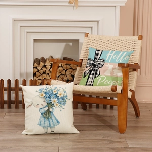 Easter bunny and floral lamb cushion covers on a cozy chair by the fireplace