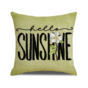 Green linen throw pillow cover featuring white flower and hello SUNSHINE print