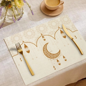 Detail of Eid Ramadan linen placemat featuring golden moon and lantern prints on beige