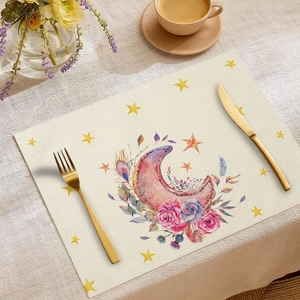 Close-up of linen place mat with moon and floral print for elegant dining table decor