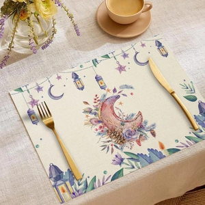 Detail of linen placemat featuring Ramadan moon and oil lamp watercolor prints