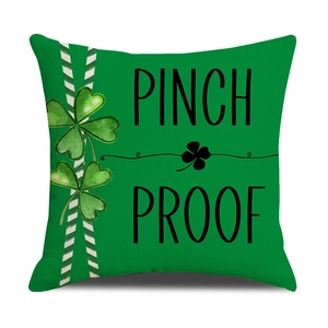 Modern St. Patrick's Day green throw pillow with Pinch Proof text and clover pattern