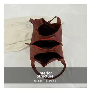 Detailed top view of large capacity tote bag featuring multi-layer internal compartments