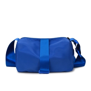 Blue oxford cylinder crossbody bag with adjustable wide strap for fitness and casual use