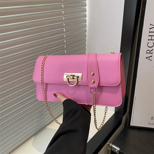 Pink faux leather shoulder bag with gold chain strap and decorative buckle closure