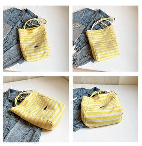 Detailed four-way views of the yellow striped canvas tote bag with dual handles