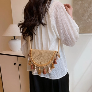 Bohemian woven straw shoulder bag with ethnic embroidery and colorful tassels