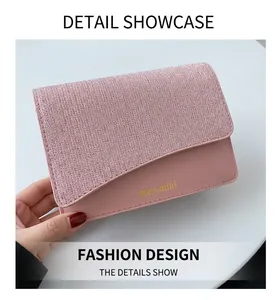 Close-up of pink glitter fabric and matte leather shoulder bag with gold miss.mini logo