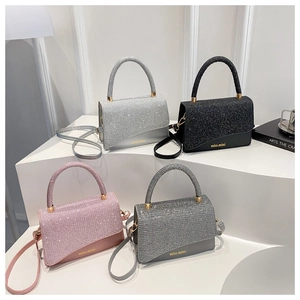 Chic sequined tote bags in silver, black, pink, and grey with gold hardware details