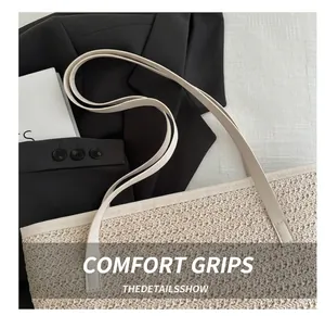 Detailed close-up of straw tote bag with fine weaving and slender leather shoulder straps