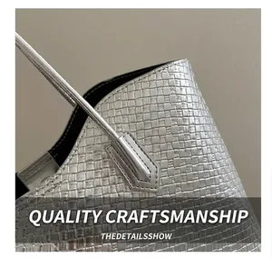 Close-up of metallic silver tote bag featuring high-quality square woven texture details