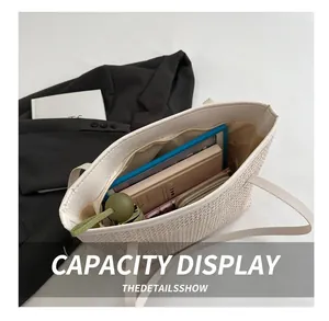Detail of spacious woven tote bag showing interior storage for tablet and umbrella