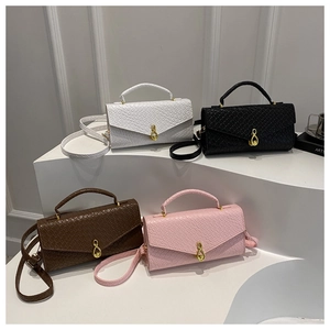 Detailed display of crocodile pattern handbags in white, black, brown and pink colors
