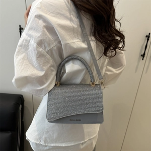 Chic silver glitter crossbody bag for women featuring a minimalist square design with top handle