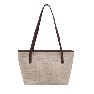 Minimalist straw tote bag with brown leather straps for summer outdoor beach leisure