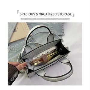 Interior view of silver textured crossbody bag showing organized storage for essentials
