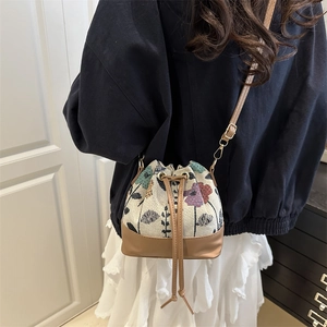 Summer 2025 retro jacquard canvas bucket bag with floral patterns and leather straps