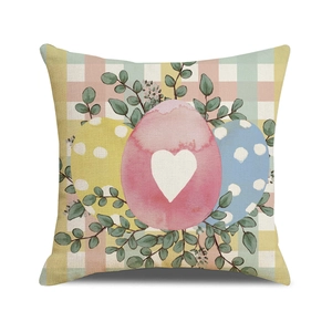 Gingham Easter pillow cover featuring colorful eggs and eucalyptus on white background