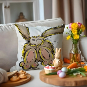 Easter bunny and carrot throw pillow cover on a white sofa with festive decorations