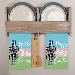 Close-up of Easter kitchen towels with Happy Easter rabbit prints and decorative bows