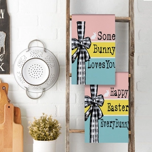 Close-up of Easter kitchen towels with bunny prints and Some Bunny Loves You text