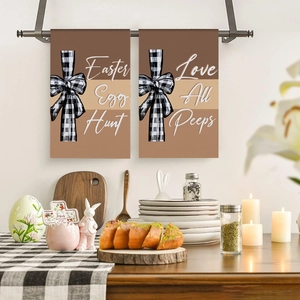 Close-up of Easter kitchen towels with bunny prints and black white checkered bows
