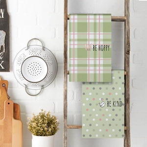 Easter kitchen towel set with cute bunny print and Be Hoppy text on green fabric