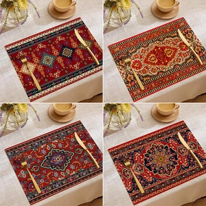 Detail view of four bohemian linen placemats featuring vintage Persian floral patterns