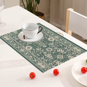 Detailed view of bohemian floral placemat with intricate ethnic patterns on a white table