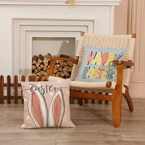 Easter rabbit linen cushion covers with HAPPY EASTER print in a cozy home setting