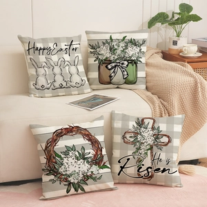 Set di 4 federe pasquali con motivi di conigli e fiori su un divano beige