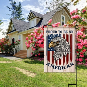 Garden flag detail featuring American bald eagle and Proud To Be An American slogan