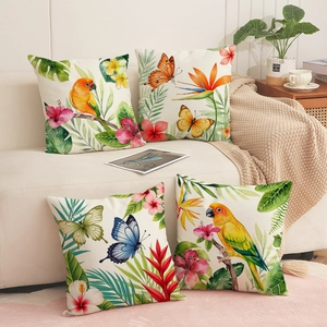 Set of four watercolor tropical bird and hibiscus flower prints on polyester pillow covers